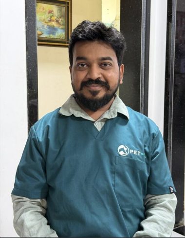 Dr Priyesh of the Vet 24-7 veterinary team in Pet 24-7 scrubs